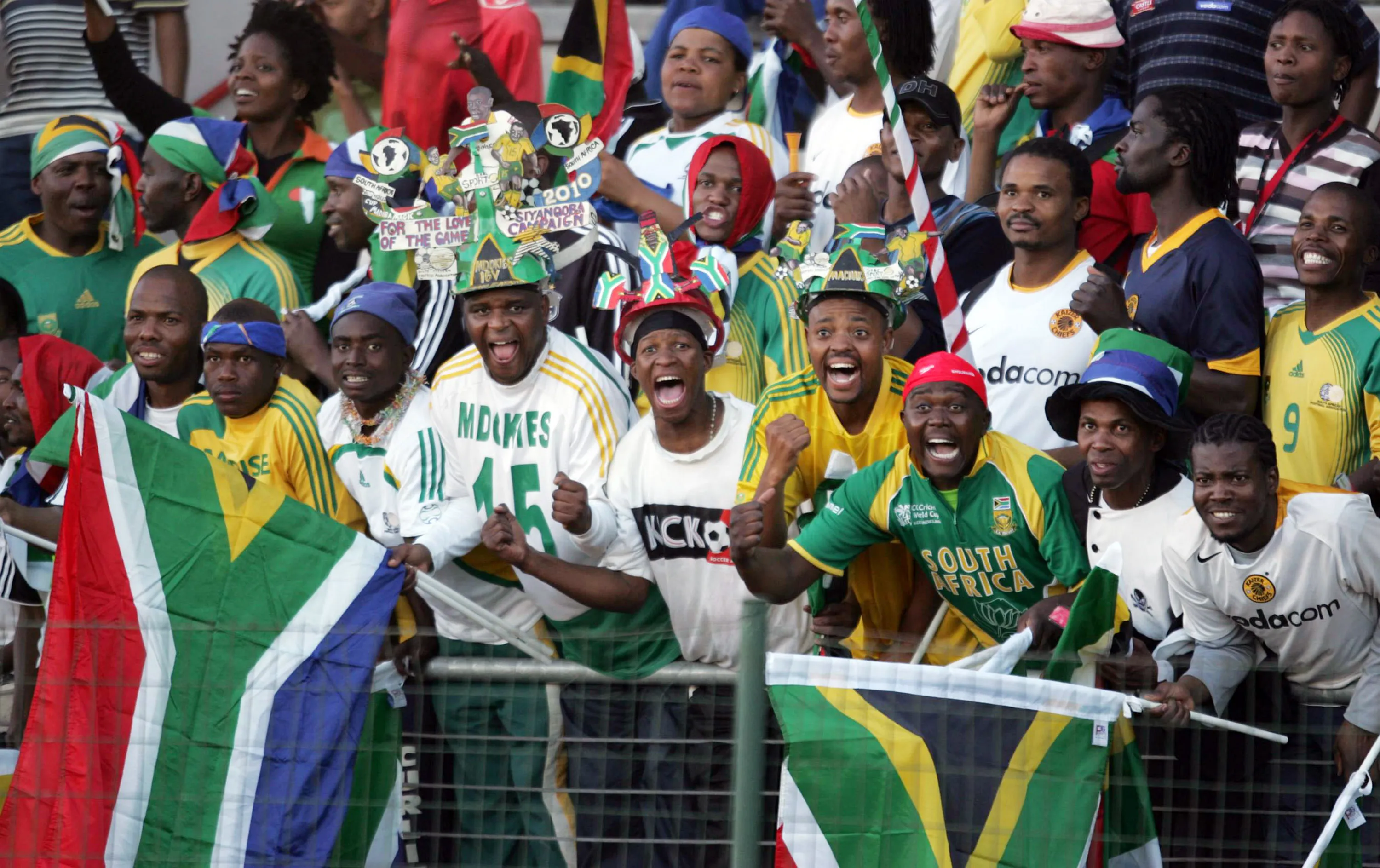 ATTERIDGEVILLE, SOUTH AFRICA – JUNE 7: South African fans celebrates during the Africa Cup Of Nations and FIFA 2010 World Cup qualifying match between South Africa and Equatorial Guinea at the Super Stadium on June 7, 2008 in Atteridgeville, South Africa. (Photo by Lefty Shivambu/Gallo Images/Getty Images)