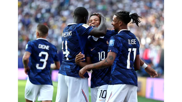 EAST RUTHERFORD, NEW JERSEY - JUNE 30: Kylian Mbappe #10 of France celebrates with Dayot Upamecano #4 and Michael Olise #11 after scoring the team's third goal during the FIFA World Cup 2026 Round Of 32 match between France and Sweden at New York New Jersey Stadium on June 30, 2026 in East Rutherford, New Jersey. (Photo by Al Bello/Getty Images)
