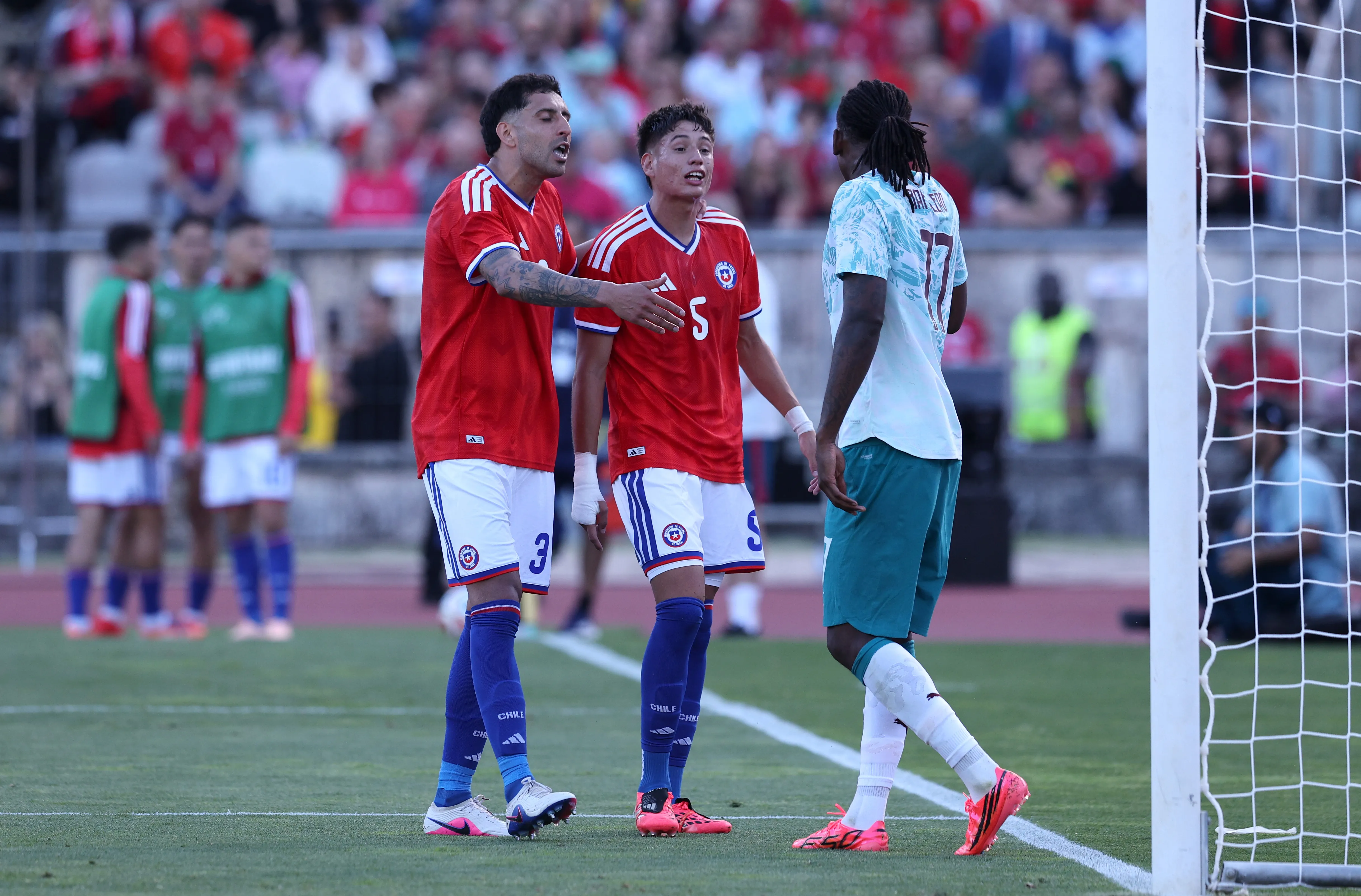 LISBON, PORTUGAL – JUNE 06: Rafael Leao #17 of Portugal speaks to Guillermo Maripan #3 and Ivan Roman #5 of Chile during the international friendly match between Portugal and Chile at Estadio Nacional do Jamor on June 06, 2026 in Lisbon, Portugal. (Photo by Carlos Rodrigues/Getty Images)