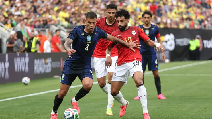 CLEVELAND, OHIO - JUNE 06: Bruno Guimarães of Brazil competes for the ball against Marawan Attia of Egypt during the international friendly match between Brazil and Egypt at Huntington Bank Field on June 06, 2026 in Cleveland, Ohio. (Photo by Kirk Irwin/Getty Images)