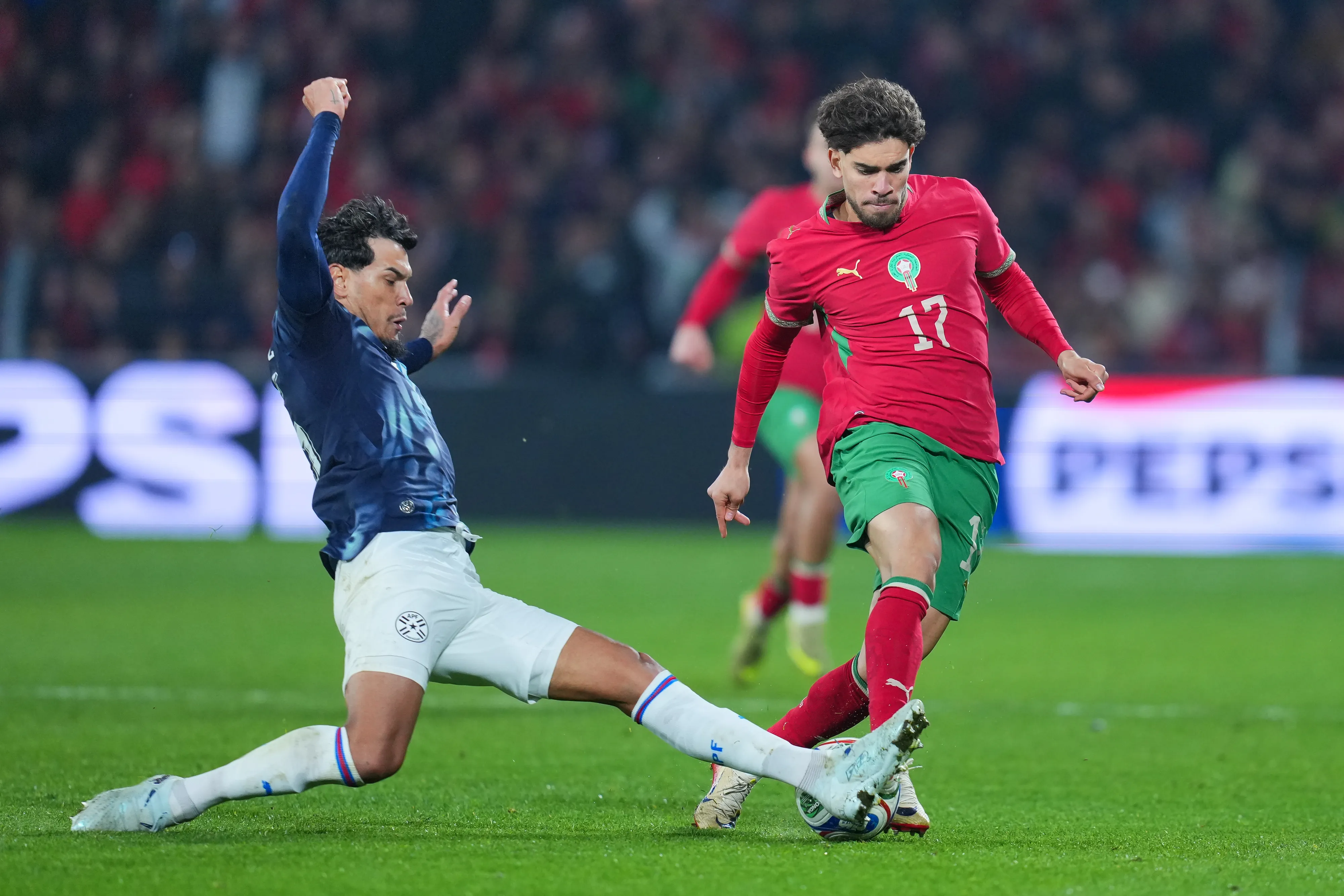 LENS, FRANCE – MARCH 31: Abdessamad Ezzalzouli of Morocco competes for the ball with Gustavo Gomez of Paraguay during the international friendly match between Morocco and Paraguay at Stade Bollaert-Delelis on March 31, 2026 in Lens, France. (Photo by Franco Arland/Getty Images)
