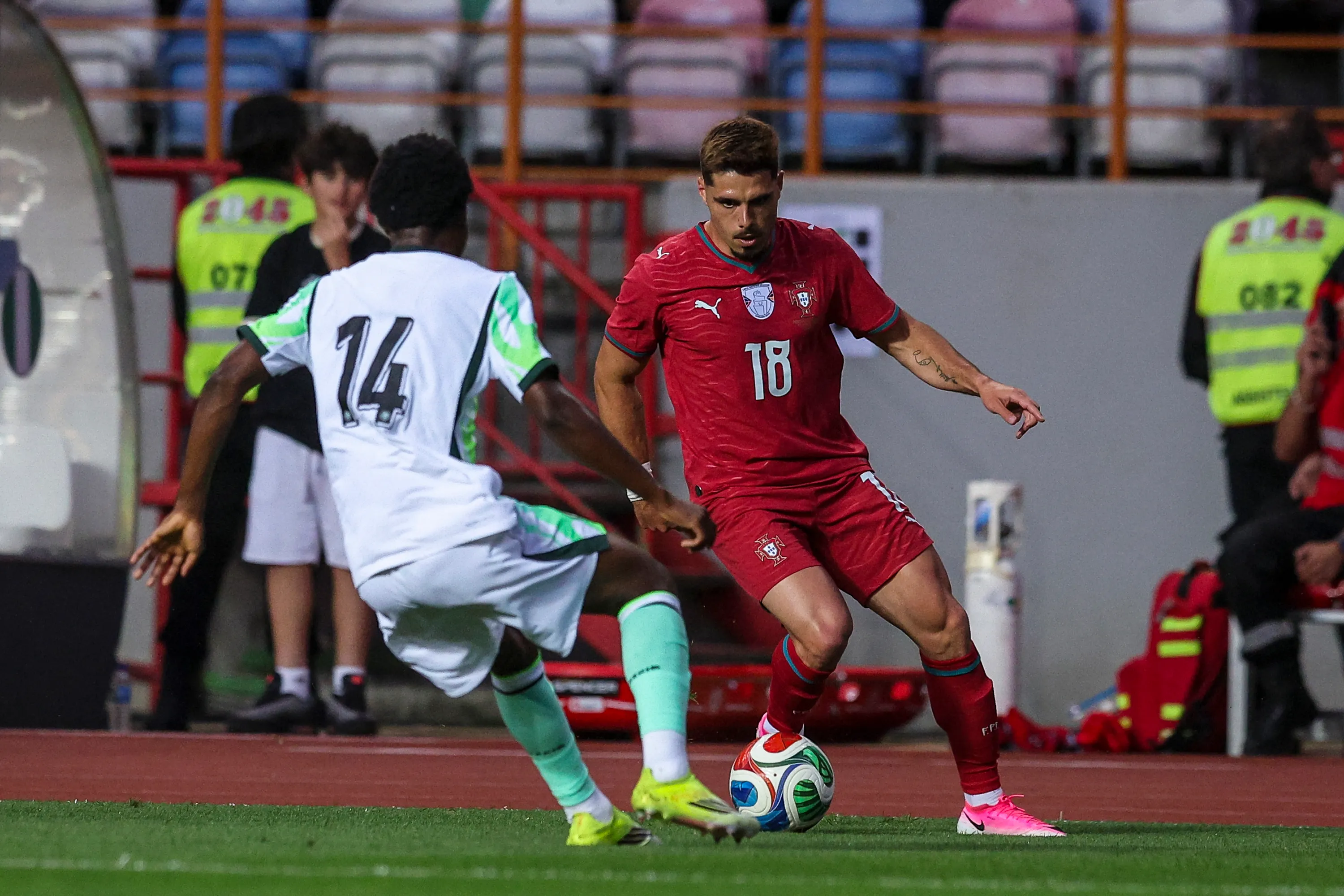 LEIRIA, PORTUGAL – JUNE 10: Pedro Neto of Portugal (R) tries to pass trough Rafiu Durosinmi of Nigeria (L) during the International Friendly match between Portugal and Nigeria at Estadio Dr Magalhaes Pessoa on June 10, 2026 in Leiria, Portugal. (Photo by Carlos Rodrigues/Getty Images)