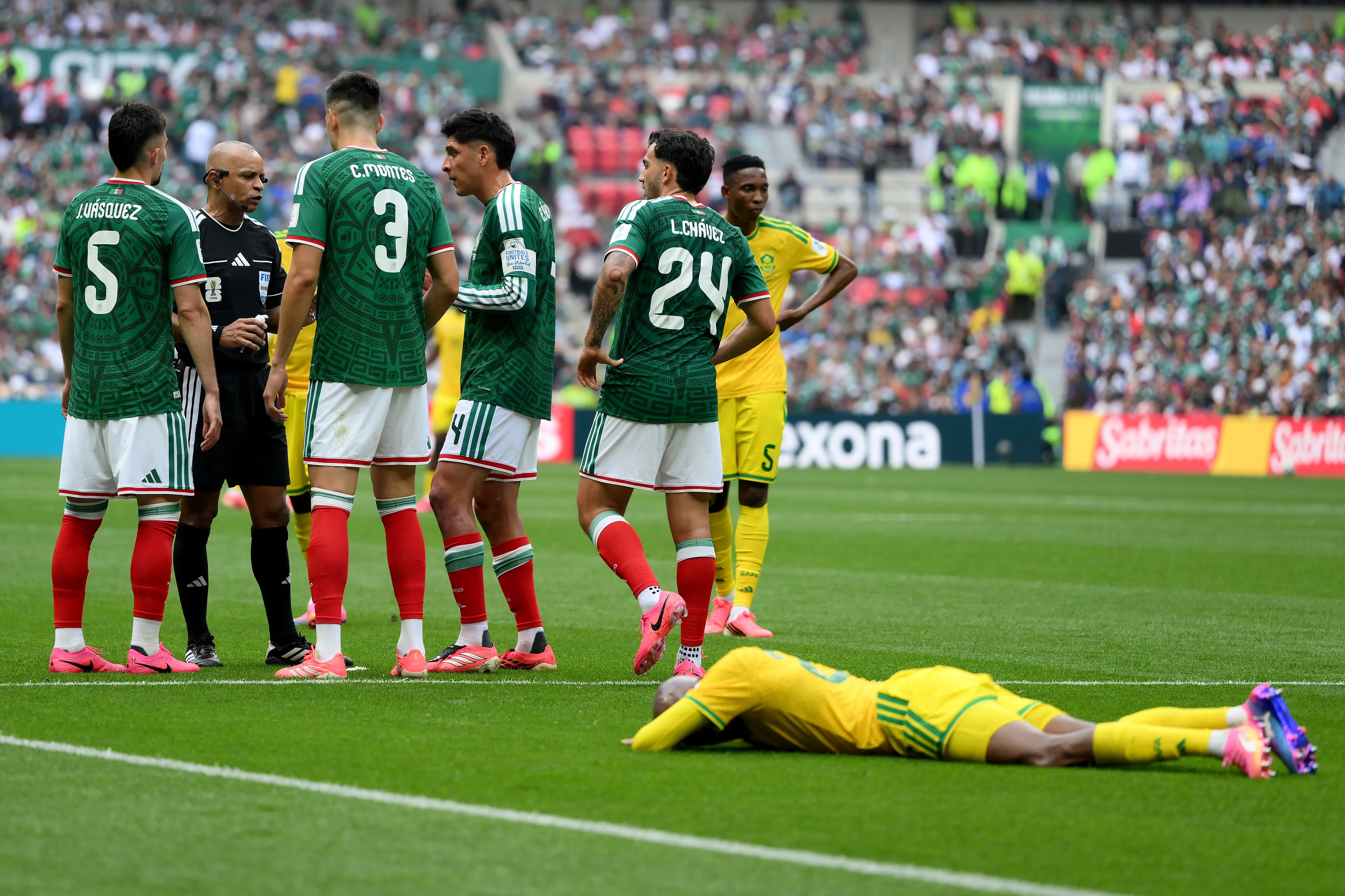 MEXICO CITY, MEXICO – JUNE 11: Cesar Montes #3 of Mexico and teammates argue with referee Wilton Sampaio after being issued a red card during the FIFA World Cup 2026 Group A match between Mexico and South Africa at Mexico City Stadium on June 11, 2026 in Mexico City, Mexico. (Photo by David Ramos/Getty Images)