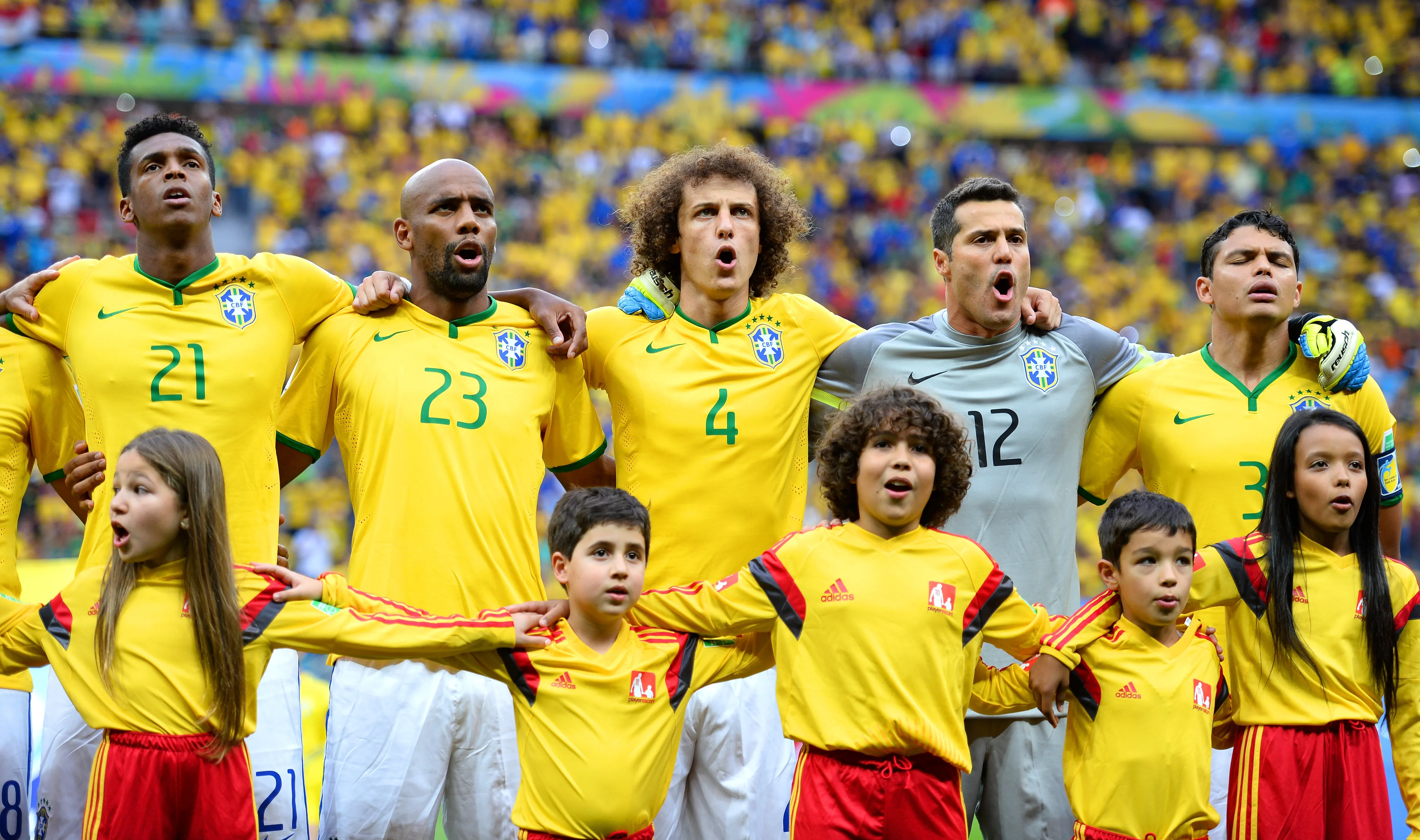 BRASILIA, BRAZIL – JULY 12: Jo, Maicon, David Luiz, Julio Cesar and Thiago Silva of Brazil sing the National Anthem prior to during the 2014 FIFA World Cup Brazil Third Place Playoff match between Brazil and the Netherlands at Estadio Nacional on July 12, 2014 in Brasilia, Brazil. (Photo by Jamie McDonald/Getty Images)