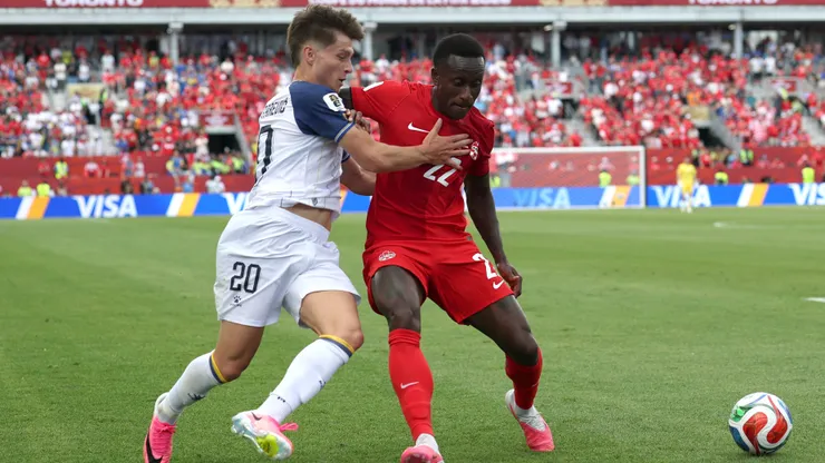 TORONTO, ONTARIO - JUNE 12: Richie Laryea #22 of Canada is challenged by Esmir Bajraktarevic #20 of Bosnia and Herzegovina during the FIFA World Cup 2026 Group B match between Canada and Bosnia and Herzegovina at Toronto Stadium on June 12, 2026 in Toronto, Ontario. (Photo by Charlotte Wilson/Getty Images)