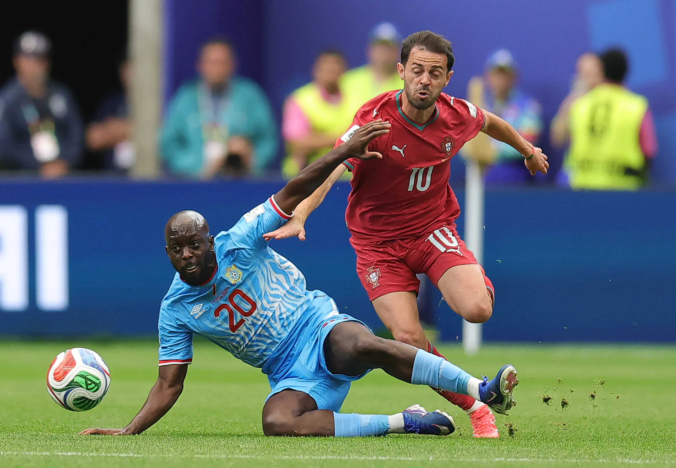 HOUSTON, TEXAS – JUNE 17: Yoane Wissa #20 of Congo DR is challenged by Bernardo Silva #10 of Portugal during the FIFA World Cup 2026 Group K match between Portugal and Congo DR at Houston Stadium on June 17, 2026 in Houston, Texas. (Photo by Alex Slitz/Getty Images)