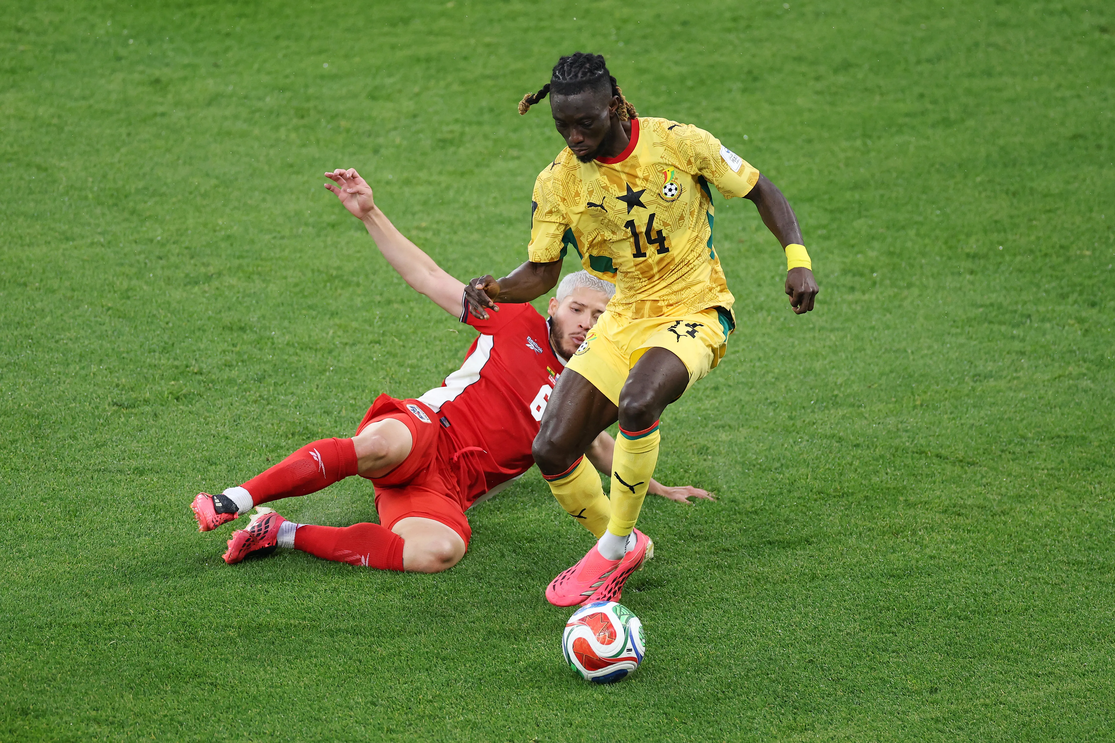 TORONTO, ONTARIO – JUNE 17: Gideon Mensah #14 of Ghana is tackled by Cristian Martinez #6 of Panama during the FIFA World Cup 2026 Group L match between Ghana and Panama at Toronto Stadium on June 17, 2026 in Toronto, Ontario. (Photo by Dan Mullan/Getty Images)