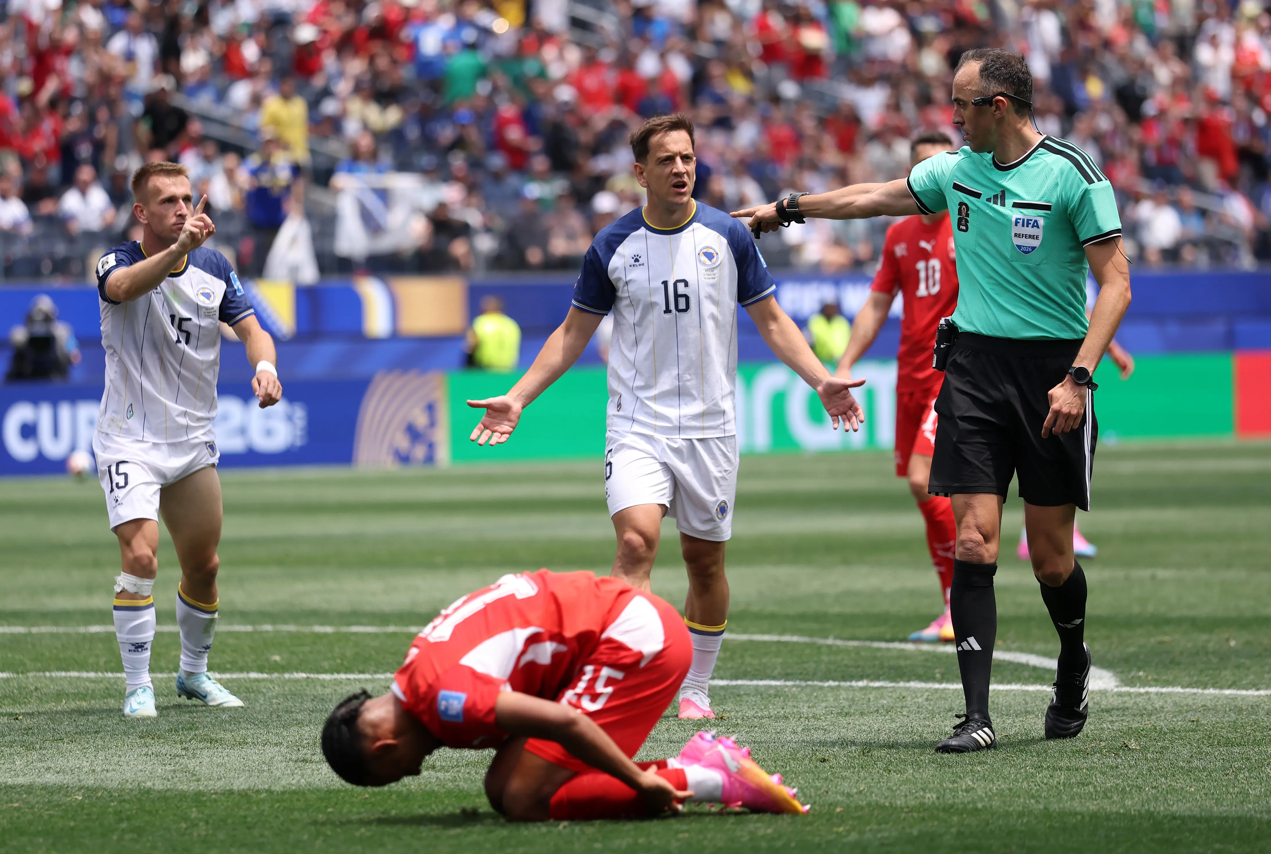 INGLEWOOD, CALIFORNIA – JUNE 18: Referee Joao Pinheiro calls for a penalty after Djibril Sow #15 of Switzerland is fouled in the box by Amar Memic #15 of Bosnia and Herzegovina during the FIFA World Cup 2026 Group B match between Switzerland and Bosnia and Herzegovina at Los Angeles Stadium on June 18, 2026 in Inglewood, California. (Photo by Dean Mouhtaropoulos/Getty Images)