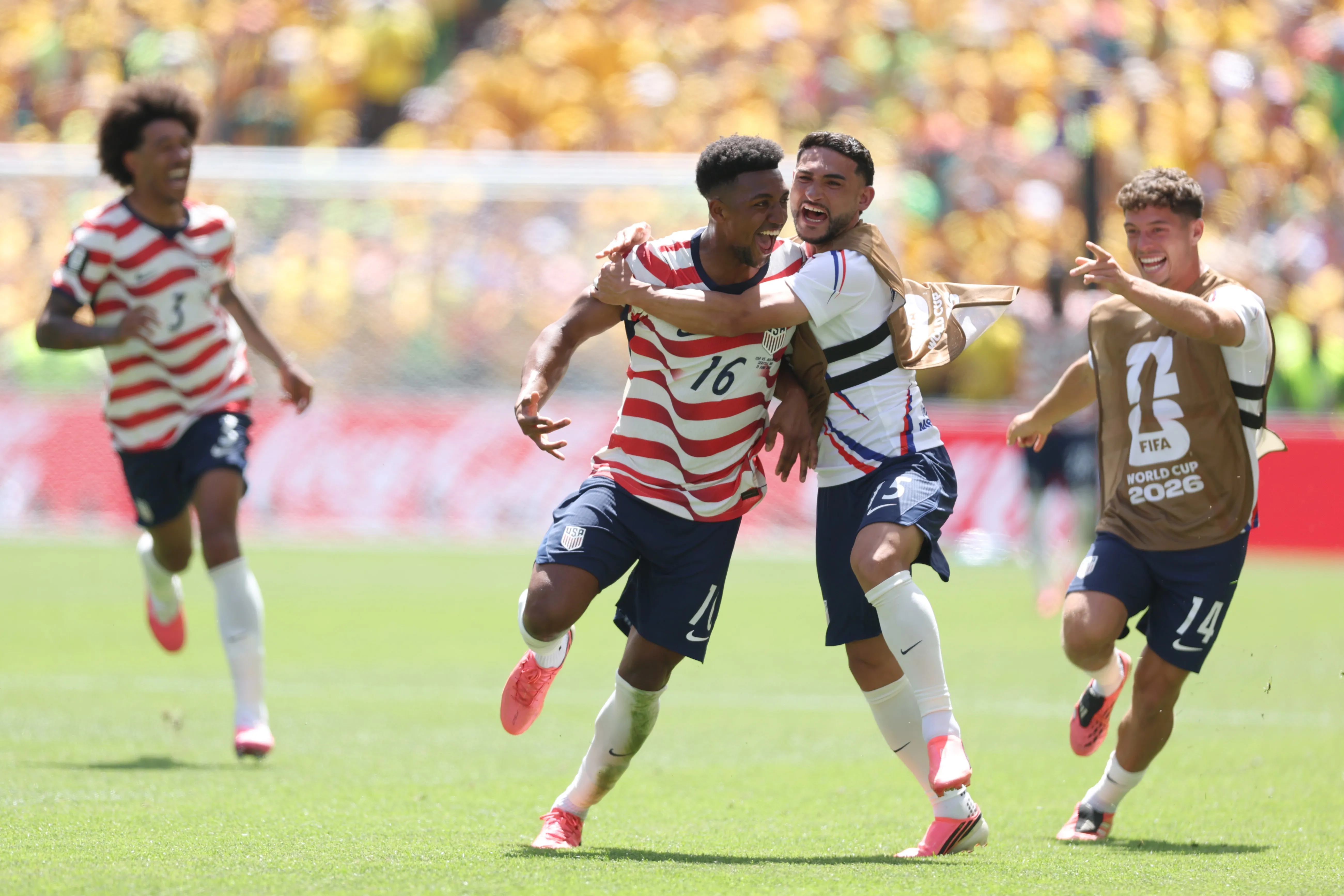 SEATTLE, WASHINGTON – JUNE 19: Alex Freeman #16 of the United States celebrates with teammate Cristian Roldan #15 after scoring his team’s second goal during the FIFA World Cup 2026 Group D match between USA and Australia at Seattle Stadium on June 19, 2026 in Seattle, Washington. (Photo by Jamie Squire/Getty Images)