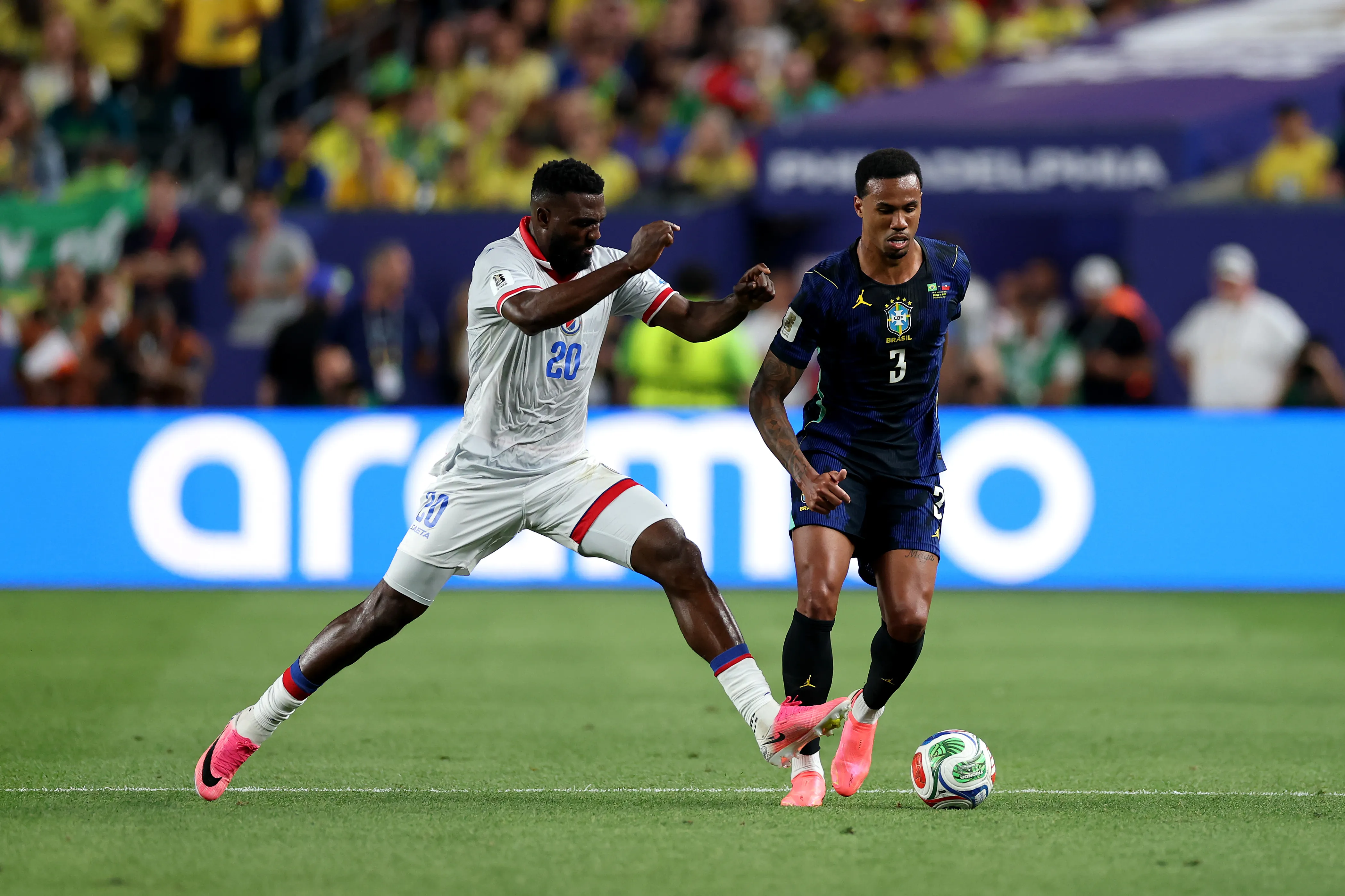 PHILADELPHIA, PENNSYLVANIA – JUNE 19: Gabriel Magalhaes #3 of Brazil is challenged by Frantzdy Pierrot #20 of Haiti during the FIFA World Cup 2026 Group C match between Brazil and Haiti at Philadelphia Stadium on June 19, 2026 in Philadelphia, Pennsylvania. (Photo by Dan Mullan/Getty Images)