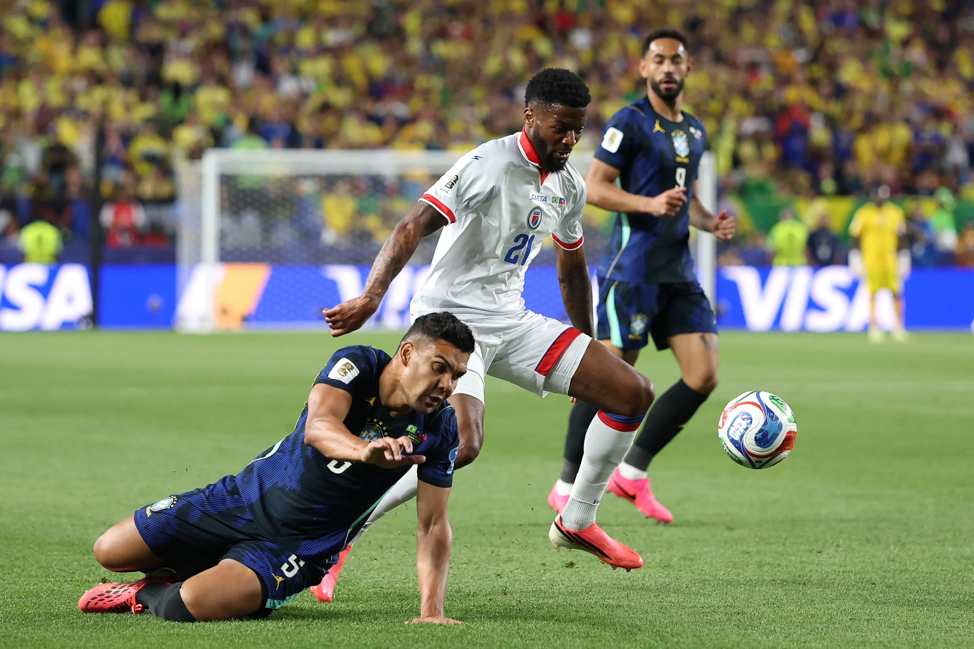 PHILADELPHIA, PENNSYLVANIA – JUNE 19: Casemiro #5 of Brazil and Josue Casimir #21 of Haiti compete for the ball during the FIFA World Cup 2026 Group C match between Brazil and Haiti at Philadelphia Stadium on June 19, 2026 in Philadelphia, Pennsylvania. (Photo by Darrian Traynor/Getty Images)