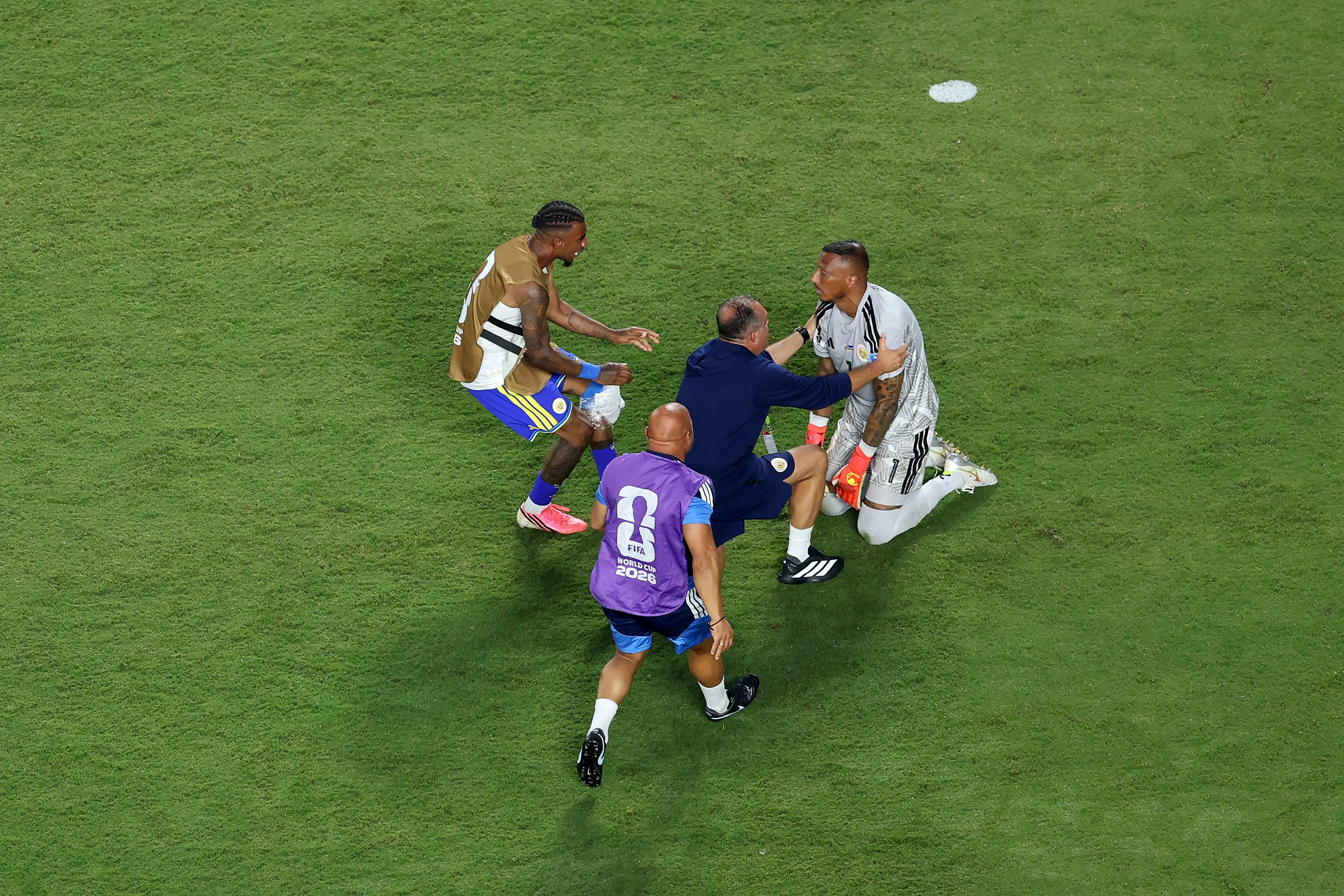 KANSAS CITY, MISSOURI – JUNE 20: Eloy Room #1 of Curacao is embraced by teammates the 0-0 draw during the FIFA World Cup 2026 Group E match between Ecuador and Curacao at Kansas City Stadium on June 20, 2026 in Kansas City, Missouri. (Photo by Michael Steele/Getty Images)