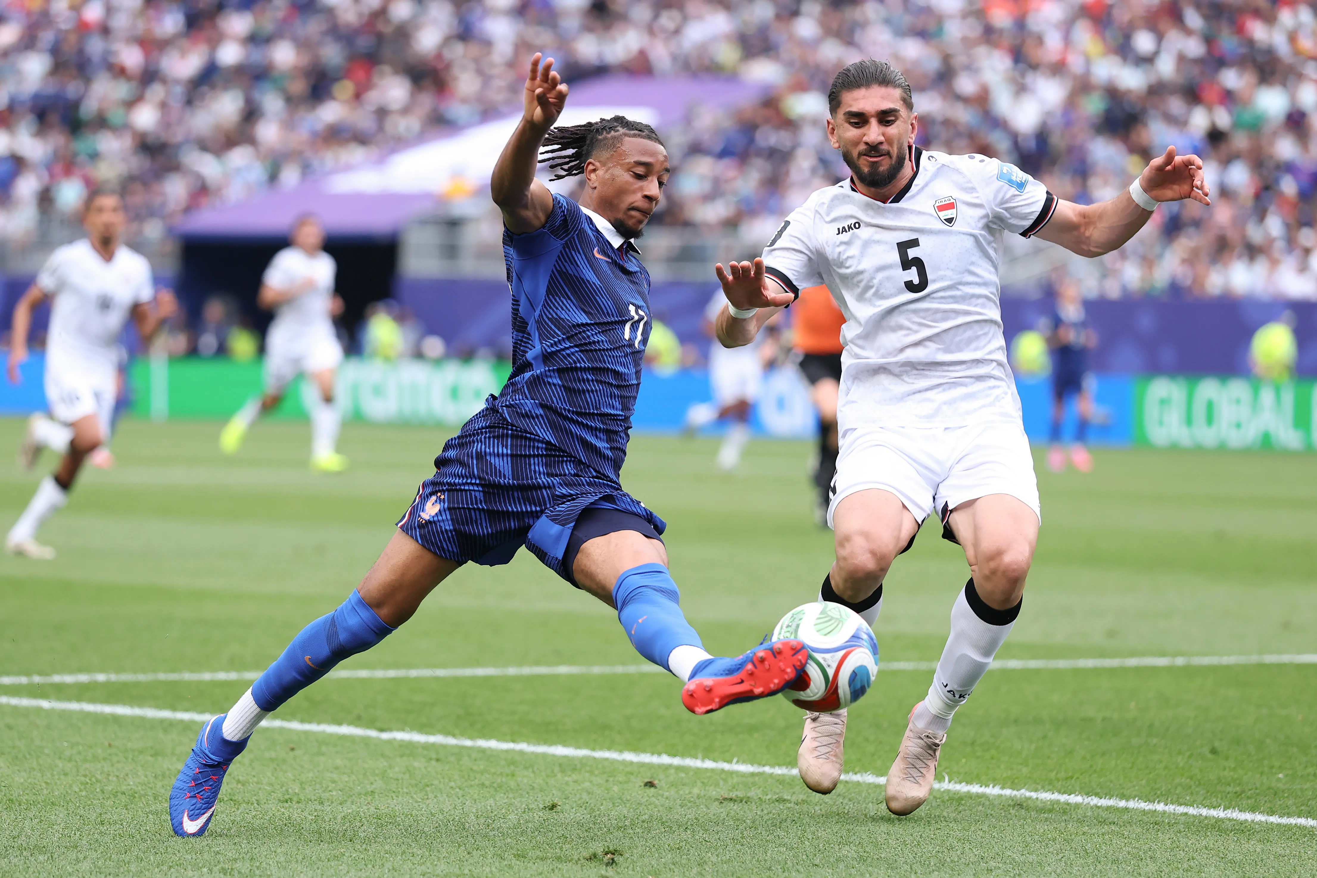 PHILADELPHIA, PENNSYLVANIA – JUNE 22: Michael Olise #11 of France takes on Akam Hashim #5 of Iraq during the FIFA World Cup 2026 Group I match between France and Iraq at Philadelphia Stadium on June 22, 2026 in Philadelphia, Pennsylvania. (Photo by Kevin C. Cox/Getty Images)