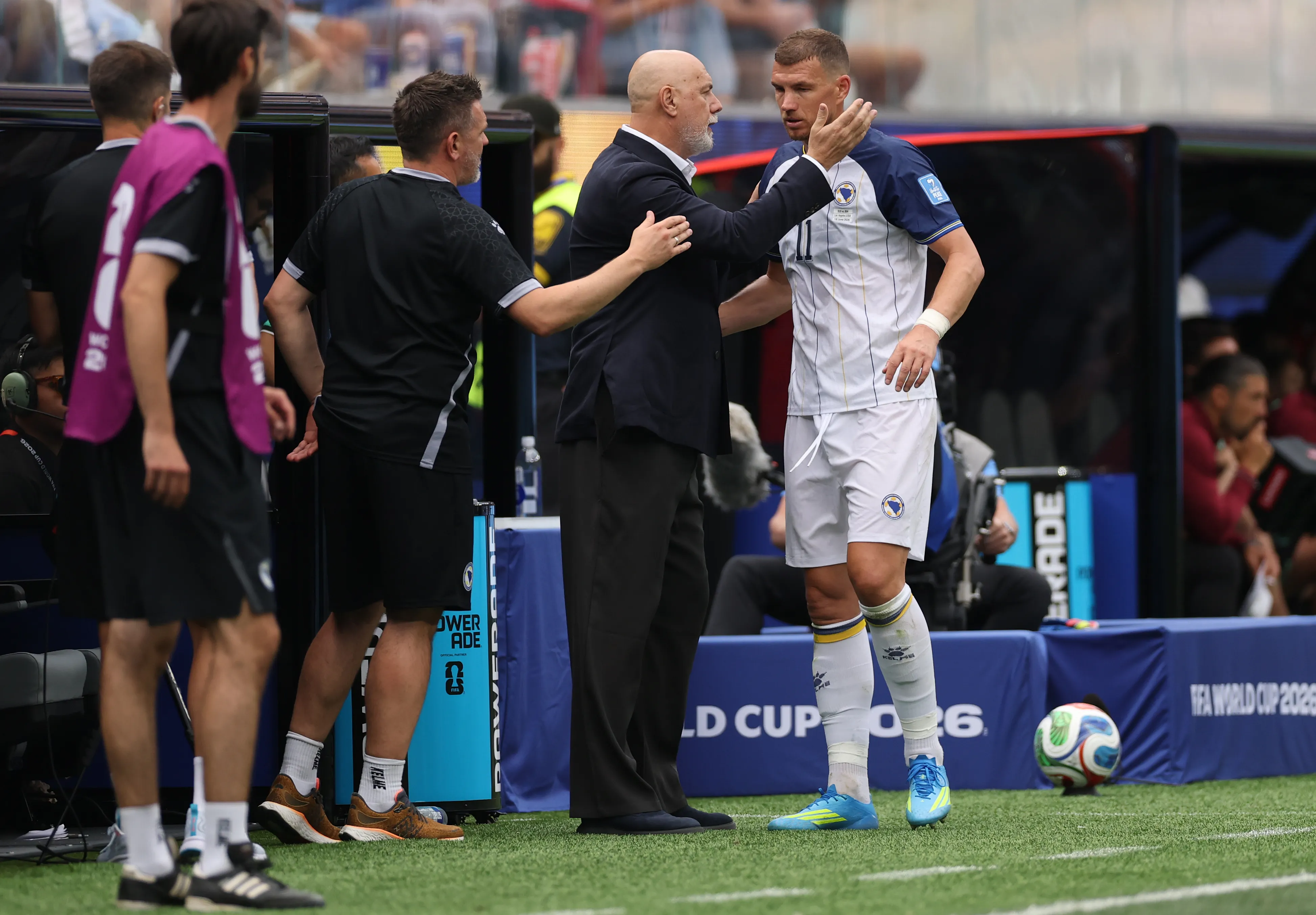 INGLEWOOD, CALIFORNIA- JUNE 18: Sergej Barbarez, Head Coach of Bosnia and Herzegovina, embraces Edin Dzeko #11 following a substitution during the FIFA World Cup 2026 Group B match between Switzerland and Bosnia and Herzegovina at Los Angeles Stadium on June 18, 2026 in Los Angeles, California. (Photo by Stu Forster/Getty Images)