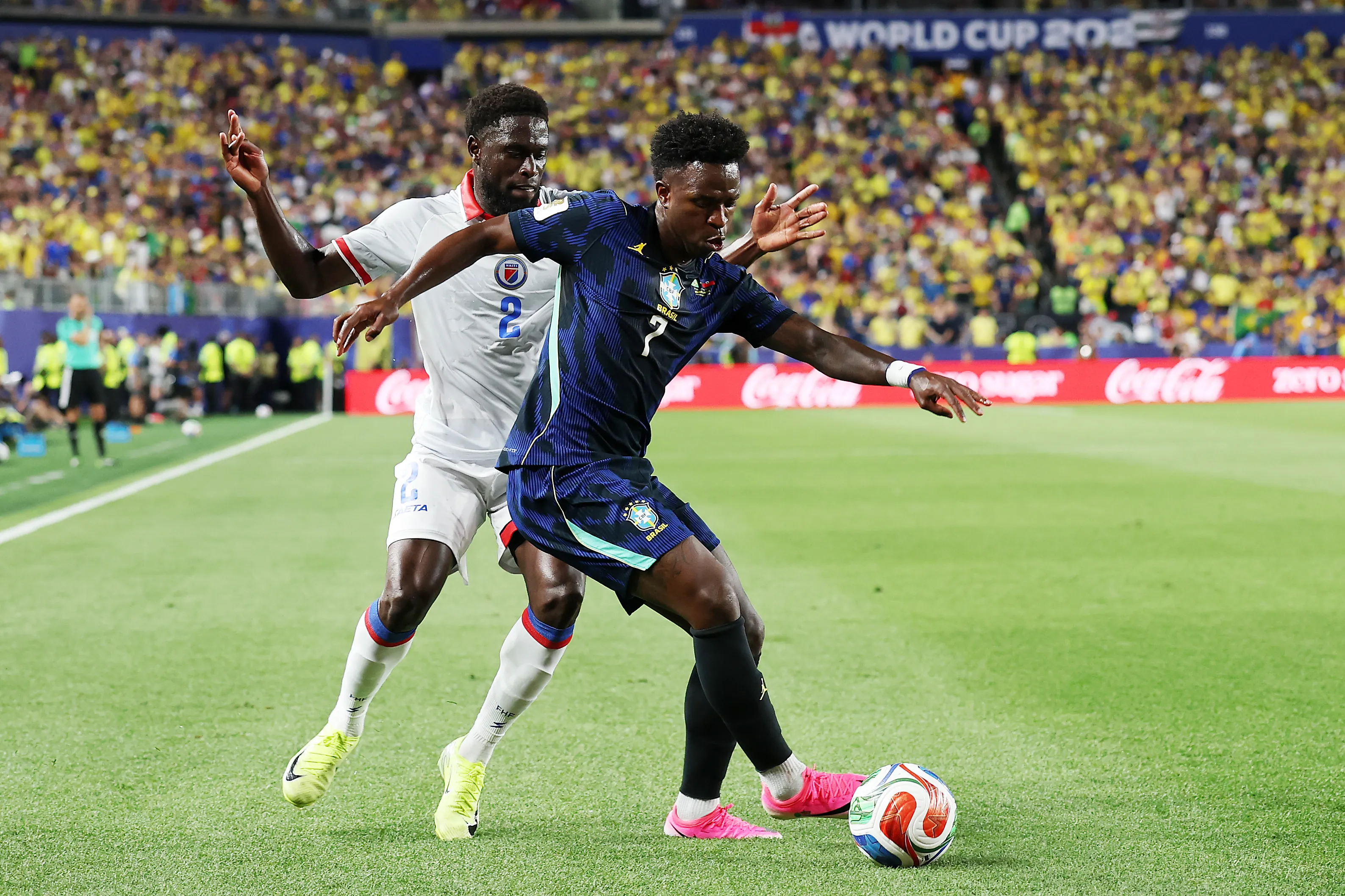 PHILADELPHIA, PENNSYLVANIA – JUNE 19: Vinicius Junior #7 of Brazil controls the ball under pressure from Carlens Arcus #2 of Haiti during the FIFA World Cup 2026 Group C match between Brazil and Haiti at Philadelphia Stadium on June 19, 2026 in Philadelphia, Pennsylvania. (Photo by Darrian Traynor/Getty Images)