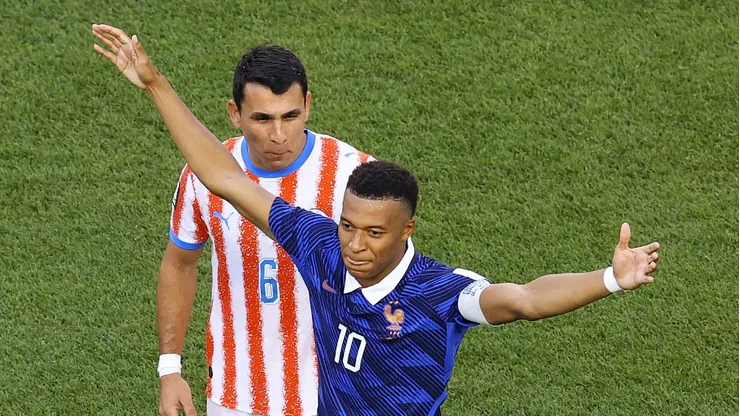 PHILADELPHIA, PENNSYLVANIA - JULY 04: Kylian Mbappe #10 of France celebrates scoring a penalty for the team's first goal as Junior Alonso #6 of Paraguay reacts during the FIFA World Cup 2026 Round of 16 match between Paraguay and France at Philadelphia Stadium on July 04, 2026 in Philadelphia, Pennsylvania. (Photo by Al Bello/Getty Images)