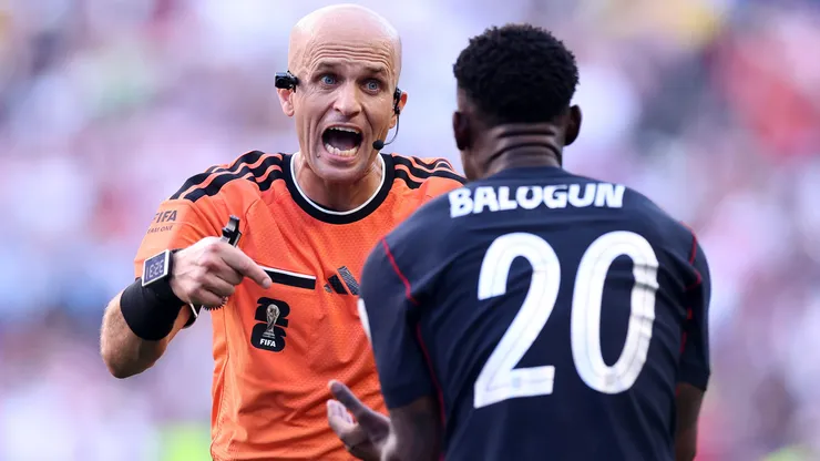 SEATTLE, WASHINGTON - JULY 06: Folarin Balogun #20 of the United States argues with referee Adham Makhadmeh during the FIFA World Cup 2026 Round of 16 match between USA and Belgium at Seattle Stadium on July 06, 2026 in Seattle, Washington. (Photo by Carl Recine/Getty Images)