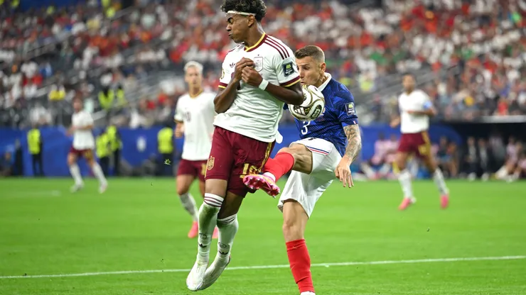 ARLINGTON, TEXAS - JULY 14: Lamine Yamal #19 of Spain is fouled in the box by Lucas Digne #3 of France during the FIFA World Cup 2026 Semi Final match between France and Spain at Dallas Stadium on July 14, 2026 in Arlington, Texas. Spain was awarded a penalty. (Photo by Shaun Botterill/Getty Images)