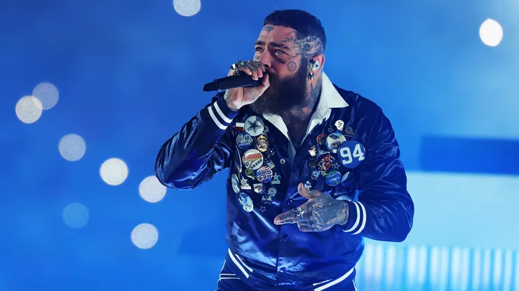 ARLINGTON, TEXAS - NOVEMBER 27: Post Malone performs at halftime during a game between the Dallas Cowboys and the Kansas City Chiefs at AT&T Stadium on November 27, 2025 in Arlington, Texas. The Cowboys defeated the Chiefs 31-28. (Photo by Stacy Revere/Getty Images)