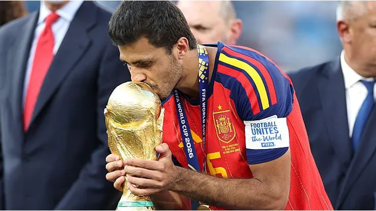 EAST RUTHERFORD, NEW JERSEY - JULY 19: Rodri #16 of Spain kisses the FIFA World Cup Winner's Trophy as he receives the medal following the FIFA World Cup 2026 Final match between Spain and Argentina at New York New Jersey Stadium on July 19, 2026 in East Rutherford, New Jersey. (Photo by Dan Mullan/Getty Images)