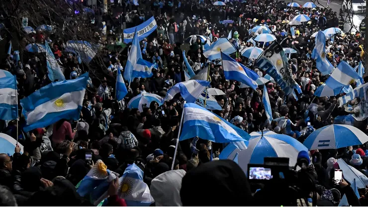 EZEIZA, ARGENTINA - JULY 20: Fans of Argentina celebrate as they wait for players and coaching staff of Argentina to arrive at Predio Lionel Andres Messi after loses the FIFA World Cup 2026 final against Spain, on July 20, 2026 in Ezeiza, Argentina. (Photo by Marcelo Endelli/Getty Images)