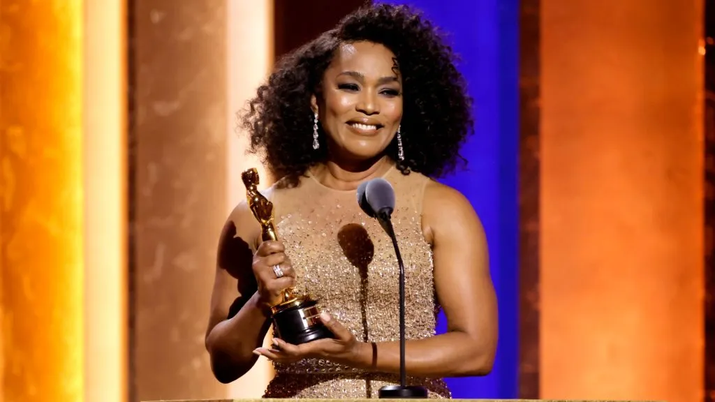 Angela Bassett accepts an honorary Oscar onstage in 2024.