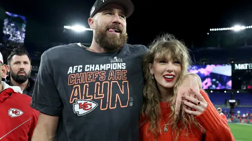 Travis Kelce #87 of the Kansas City Chiefs celebrates with Taylor Swift after a 17-10 victory against the Baltimore Ravens.