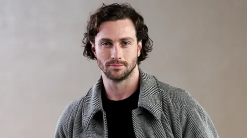 Aaron Taylor-Johnson attends the Giorgio Armani fashion show during the Milan Fashion Week Womenswear Fall/Winter 2024-2025.