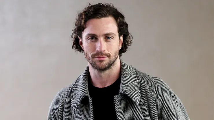 Aaron Taylor-Johnson attends the Giorgio Armani fashion show during the Milan Fashion Week Womenswear Fall/Winter 2024-2025.