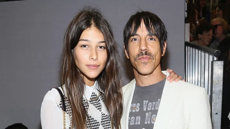 Anthony Kiedis and Helena Vestergaard attend the Tommy Hilfiger Women's fashion show during Mercedes-Benz Fashion Week Spring 2014 at Pier 94 on September 9, 2013 in New York City.
