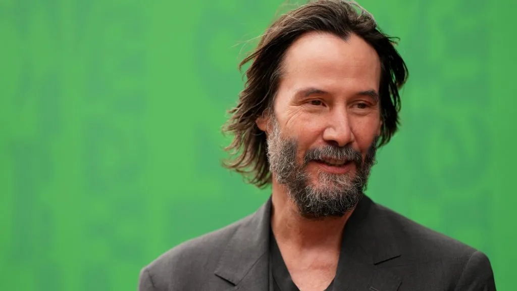 Actor Keanu Reeves looks on in the paddock before qualifying ahead of the F1 Grand Prix of Great Britain at Silverstone Circuit on July 05, 2025 in Northampton, England. (Photo by Alex Bierens de Haan/Getty Images)