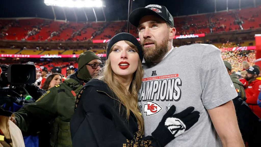 Taylor Swift celebrates with Travis Kelce #87 of the Kansas City Chiefs after defeating the Buffalo Bills 32-29 in the AFC Championship Game at GEHA Field at Arrowhead Stadium on January 26, 2025 in Kansas City, Missouri. (Photo by David Eulitt/Getty Images)