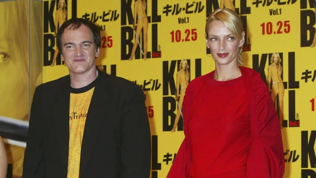 Director Quentin Tarantino and actress Uma Thurman pose for photographers at a press conference for the premiere of the new film “Kill Bill – Volume One” on October 19, 2003 in Tokyo, Japan. (Photo by Koichi Kamoshida/Getty Images)