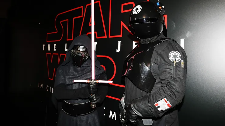 Fans pose at Star Wars: The Last Jedi booth at Armageddon on October 21, 2017.