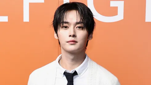 Lee Know of Stray Kids attends the Tommy Hilfiger fashion show.