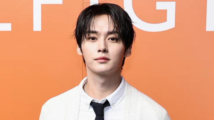 Lee Know of Stray Kids attends the Tommy Hilfiger fashion show.
