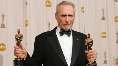 Director Clint Eastwood poses with his Oscar award for Best Director in "Million Dollar Baby" backstage during the 77th Annual Academy Awards on February 27, 2005 at the Kodak Theater in Hollywood, California. (Photo by Carlo Allegri/Getty Images)