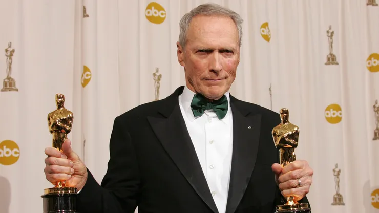 Director Clint Eastwood poses with his Oscar award for Best Director in "Million Dollar Baby" backstage during the 77th Annual Academy Awards on February 27, 2005 at the Kodak Theater in Hollywood, California. (Photo by Carlo Allegri/Getty Images)