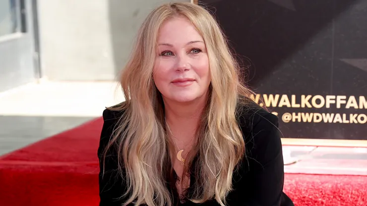 Christina Applegate poses with her star during her Hollywood Walk of Fame Ceremony in 2022.