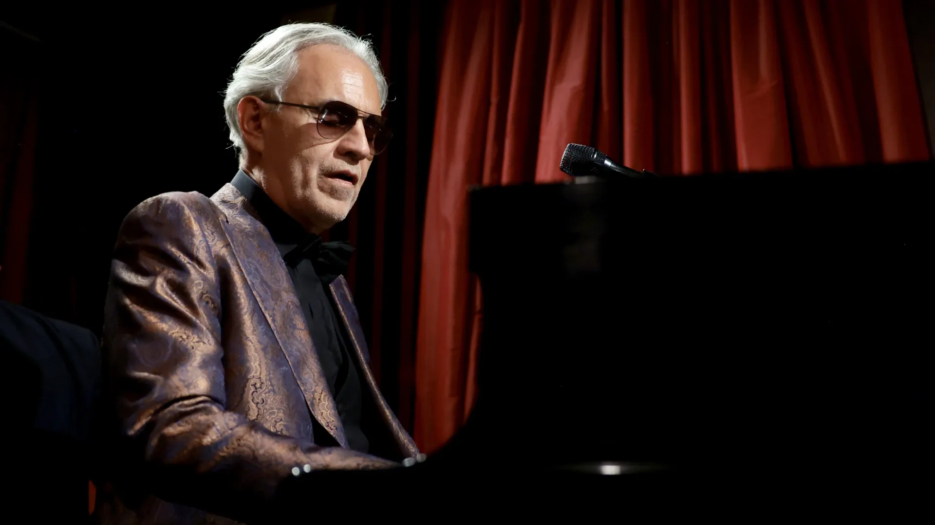 Andrea Bocelli performs onstage during the US premiere screening of “Andrea Bocelli 30: The Celebration” in 2024. (Source: Dimitrios Kambouris/Getty Images for Mercury Studios)
