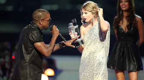 Kanye West jumps onstage after Taylor Swift won the "Best Female Video" award during the 2009 MTV Video Music Awards.