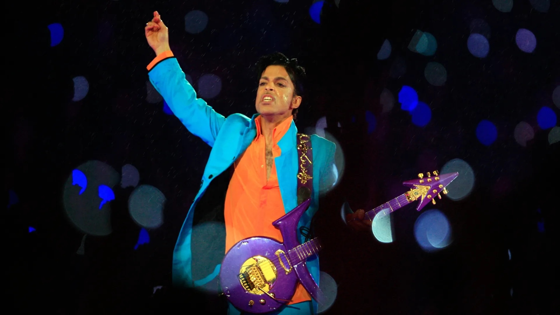 Prince performs in the rain during the ‘Pepsi Halftime Show’ at Super Bowl XLI between the Indianapolis Colts and the Chicago Bears on February 4, 2007 at Dolphin Stadium in Miami Gardens, Florida. (Photo by Jamie Squire/Getty Images)