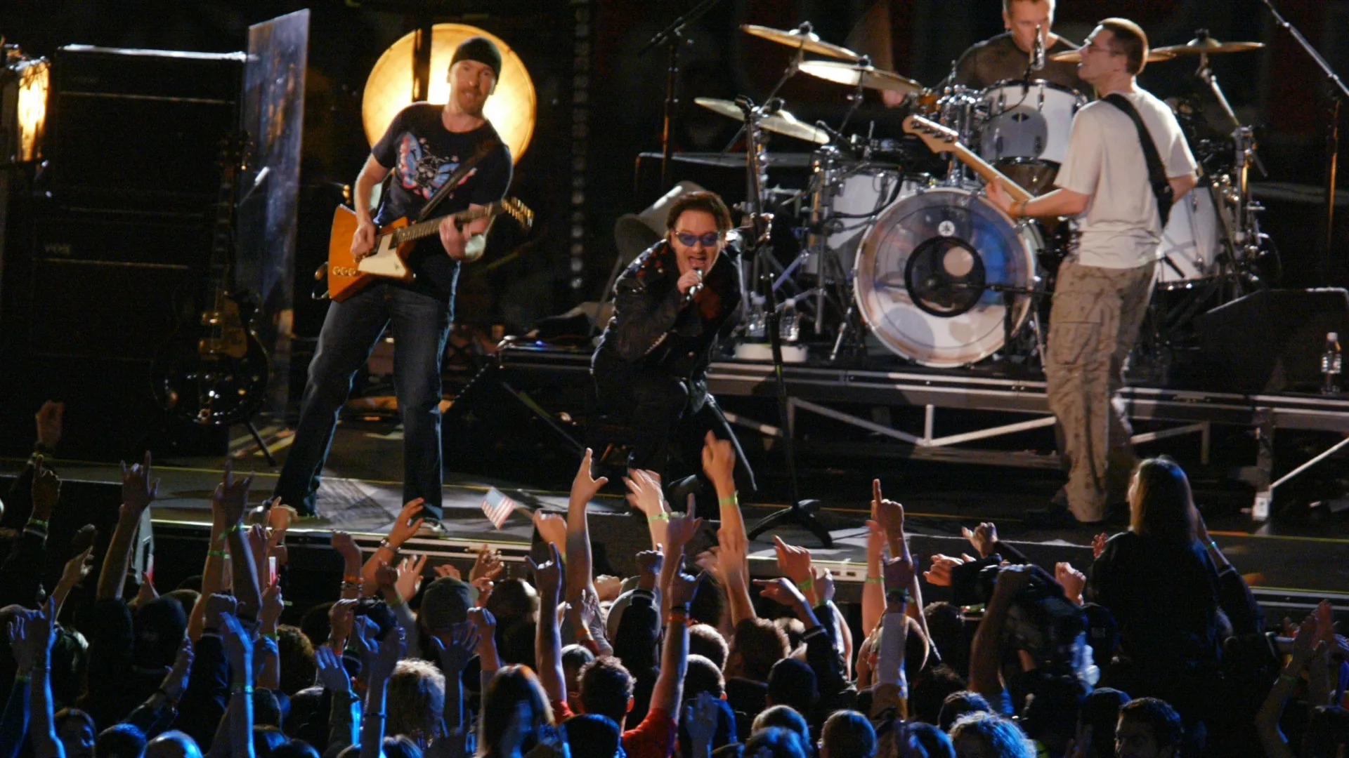 Bono and U2 performs at halftime of Super Bowl XXXVI between the New England Patriots and the St. Louis Rams at the Superdome in New Orleans, Louisiana. DIGITAL IMAGE. Mandatory Credit: Al Bello/Getty Images