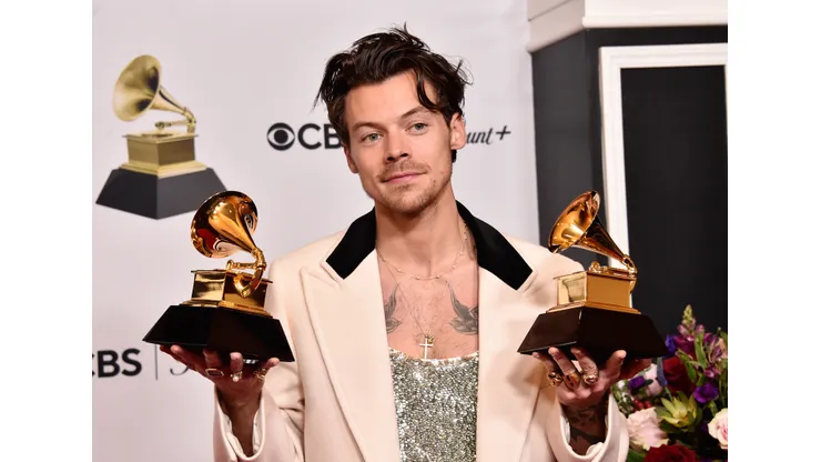 LOS ANGELES, CALIFORNIA - FEBRUARY 05: Harry Styles poses with the Best Pop Vocal Album Award for “Harry’s House” and Album of the Year Award for “Harry’s House” in the press room during the 65th GRAMMY Awards at Crypto.com Arena on February 05, 2023 in Los Angeles, California.
