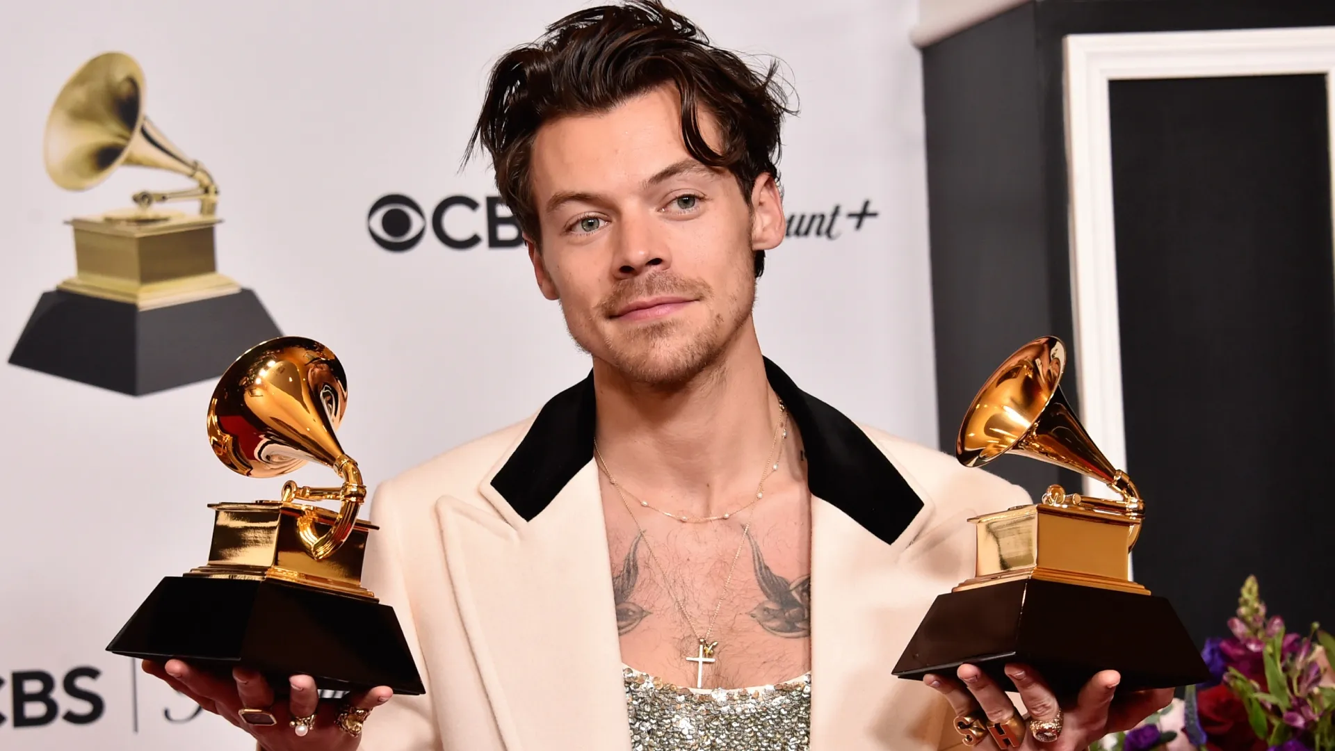 Harry Styles poses with the Best Pop Vocal Album Award for “Harry’s House” and Album of the Year Award for “Harry’s House” in the press room during the 65th GRAMMY Awards at Crypto.com Arena on February 05, 2023 in Los Angeles, California. (Photo by Alberto E. Rodriguez/Getty Images for The Recording Academy)
