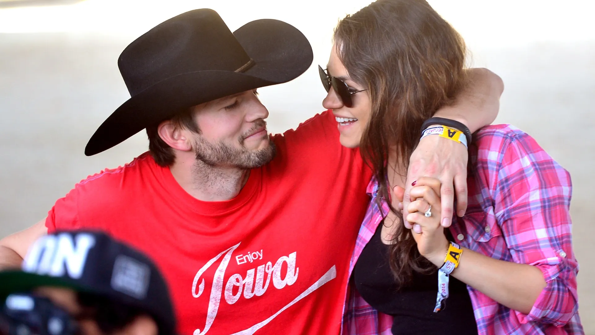 Actors Ashton Kutcher (L) and Mila Kunis attend day 1 of 2014 Stagecoach: California’s Country Music Festival at the Empire Polo Club on April 25, 2014 in Indio, California. (Photo by Frazer Harrison/Getty Images for Stagecoach)