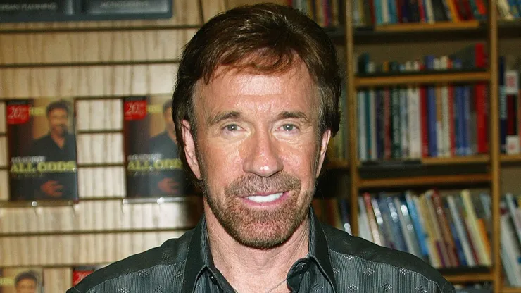 Actor Chuck Norris poses during a book signing for his new book "Against All Odds" at Borders Books.