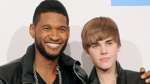 Recording Artist Usher, winner of Soul/R&B Favorite Album Award and Soul/R&B Favorite Male Artist Award (L) with Musician Justin Bieber, winner of T-Mobile Breakthrough Artist Award, Pop/Rock Favorite Male Artist Award and Artist Of The Year Award.