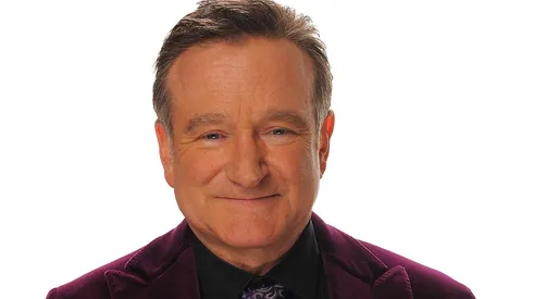 Actor Robin Williams poses for a portrait with his award for Scene Stealing Guest Star during the 35th Annual People's Choice Awards.