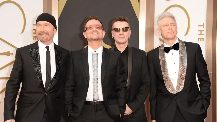 (L-R) Musicians The Edge, Bono, Larry Mullen Jr. and Adam Clayton of U2 attend the Oscars held at Hollywood & Highland Center on March 2, 2014 in Hollywood, California.